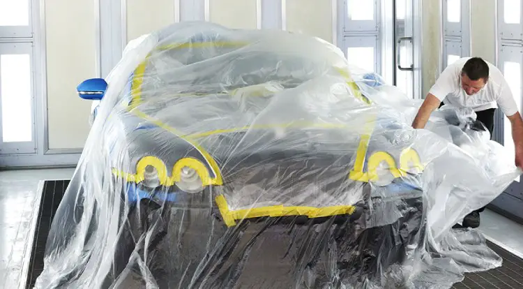 Using masking film to cover car paint surfaces